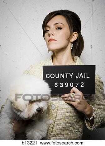 Mug shot of formally dressed woman with dog View Large Photo Image Stock Image - Mug shot of formally dressed woman with dog. Fotosearch