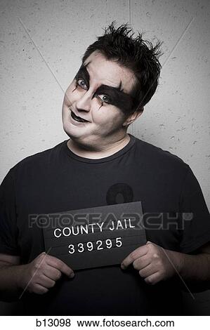 Mug shot of gothic man smiling View Large Photo Image Stock Photo - Mug shot of gothic man smiling. Fotosearch