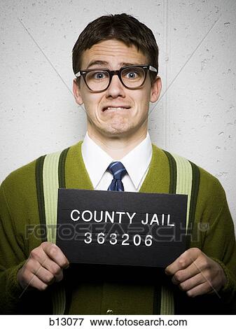 Mug shot of nerd with glasses View Large Photo Image Stock Photo - Mug shot of nerd with glasses. Fotosearch