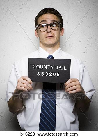 Mug shot of nerd with glasses View Large Photo Image Stock Photo - Mug shot of nerd with glasses. Fotosearch