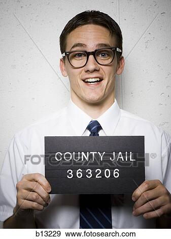 Mug shot of nerd with glasses View Large Photo Image Stock Photo - Mug shot of nerd with glasses. Fotosearch