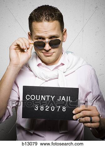 Mug shot of stylish man with sunglasses View Large Photo Image Stock Photo - Mug shot of stylish man with sunglasses. Fotosearch
