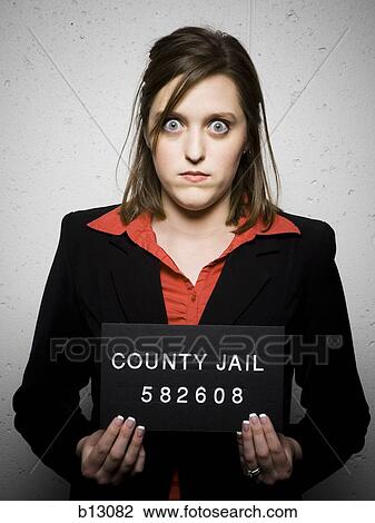 Stock Image - Mug shot of woman in business attire. Fotosearch