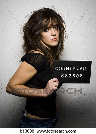 Mug shot of woman with messy hair View Large Photo Image Stock Photo - Mug shot of woman with messy hair. Fotosearch