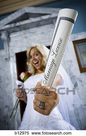 New bride waving marriage license View Large Photo Image Stock Photography - New bride waving marriage license. Fotosearch