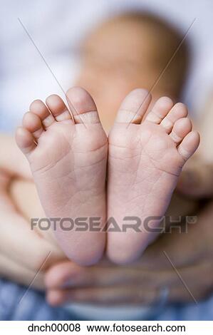 Newborn baby feet View Large Photo Image Stock Photo - Newborn baby feet. Fotosearch
