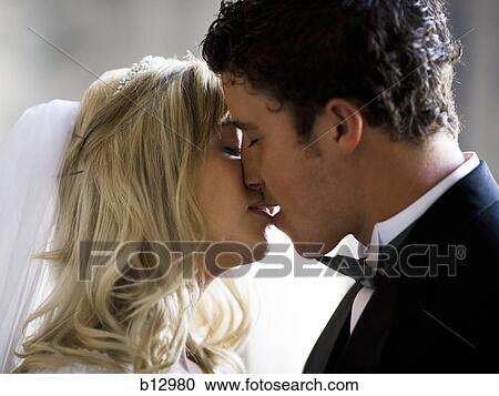 Stock Image - Newlywed bride and groom. Fotosearch