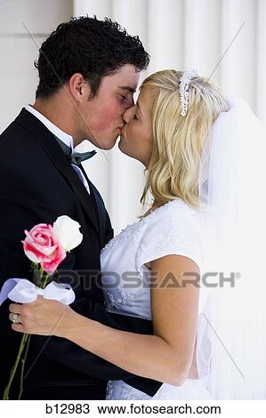 Stock Image - Newlywed bride and groom. Fotosearch