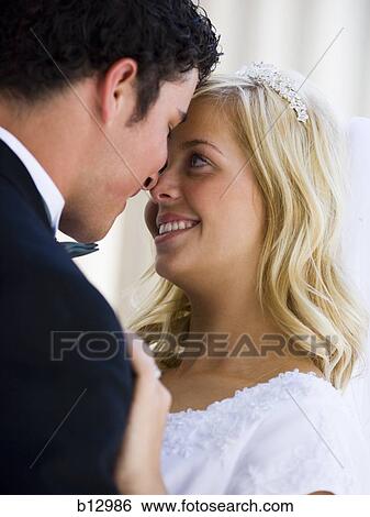 Stock Photograph - Newlywed bride and groom. Fotosearch