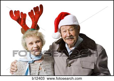 Older couple wearing Christmas hats View Large Photo Image Stock Image - Older couple wearing Christmas hats. Fotosearch