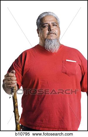 Older heavyset man with a long gray beard holding a cane View Large Photo Image Stock Photography - Older heavyset man with a long gray beard holding a cane. Fotosearch