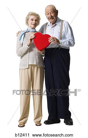 Older man giving wife Valentines chocolate View Large Photo Image Stock Image - Older man giving wife Valentines chocolate. Fotosearch