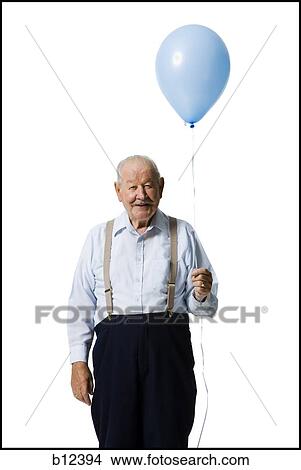 Older man holding balloon View Large Photo Image Picture - Older man holding balloon. Fotosearch