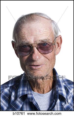 Older man in plaid shirt wearing sunglasses View Large Photo Image Stock Image - Older man in plaid shirt wearing sunglasses. Fotosearch