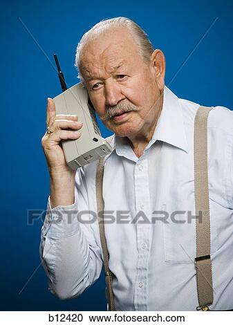 Older man making call on retro wireless phone View Large Photo Image Stock Image - Older man making call on retro wireless phone. Fotosearch