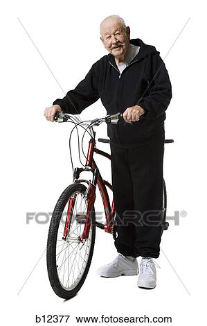 Older man with a tandem bicycle View Large Photo Image Stock Photo - Older man with a tandem bicycle. Fotosearch