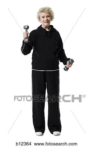Picture - Older woman doing dumbbell exercises. Fotosearch