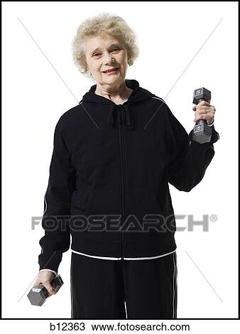 Older woman doing dumbbell exercises View Large Photo Image Stock Image - Older woman doing dumbbell exercises. Fotosearch