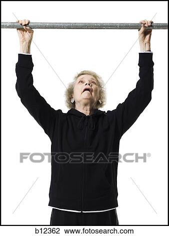 Older woman doing pull up exercises View Large Photo Image Stock Image - Older woman doing pull up exercises. Fotosearch