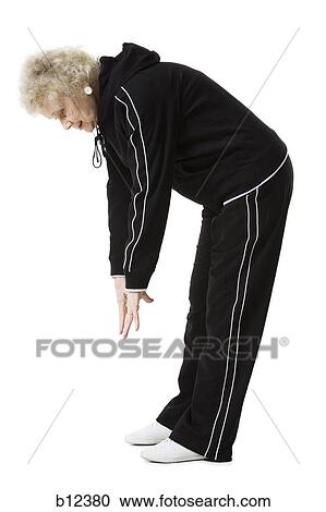 Stock Image - Older woman doing stretching exercises. Fotosearch