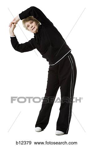 Older woman doing stretching exercises View Large Photo Image Stock Photo - Older woman doing stretching exercises. Fotosearch