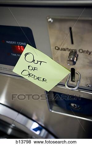 Stock Photo - Out of order sign on Laundromat machine. Fotosearch