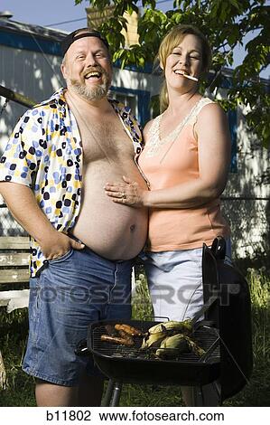 Overweight couple in a trailer park View Large Photo Image Stock Image - Overweight couple in a trailer park. Fotosearch