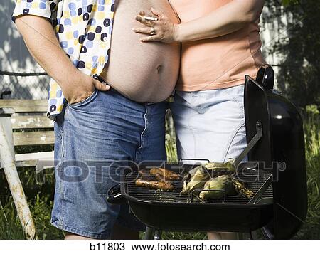 Overweight couple in a trailer park View Large Photo Image Stock Image - Overweight couple in a trailer park. Fotosearch