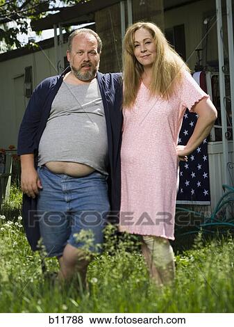 Overweight couple in a trailer park View Large Photo Image Stock Photo - Overweight couple in a trailer park. Fotosearch