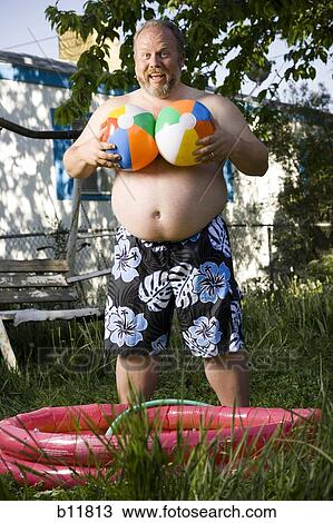 Overweight man by inflatable wading pool View Large Photo Image Stock Image - Overweight man by inflatable wading pool. Fotosearch