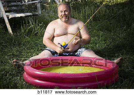 Overweight man in inflatable wading pool View Large Photo Image Stock Photo - Overweight man in inflatable wading pool. Fotosearch