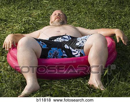 Overweight man in inflatable wading pool View Large Photo Image Stock Photo - Overweight man in inflatable wading pool. Fotosearch