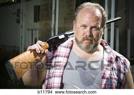 Overweight man with a shotgun View Large Photo Image Picture - Overweight man with a shotgun. Fotosearch