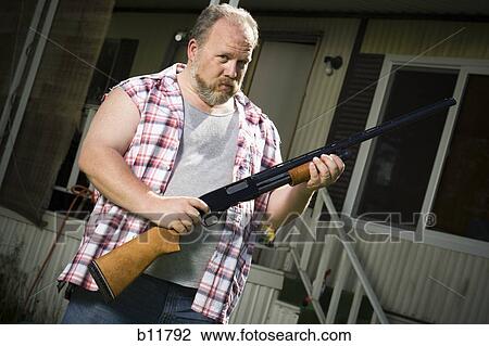 Overweight man with a shotgun View Large Photo Image Stock Image - Overweight man with a shotgun. Fotosearch