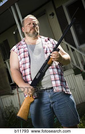 Overweight man with a shotgun View Large Photo Image Stock Image - Overweight man with a shotgun. Fotosearch