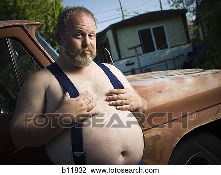 Overweight man with suspenders by truck Stock Image | b11832 | Fotosearch