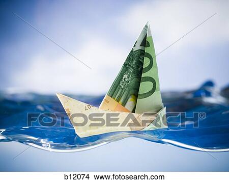 Paper sailboat made of Euro banknotes View Large Photo Image Picture - Paper sailboat made of Euro banknotes. Fotosearch
