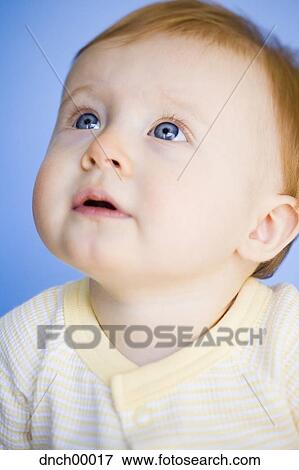 Portrait of a baby looking up View Large Photo Image Stock Photo - Portrait of a baby looking up. Fotosearch