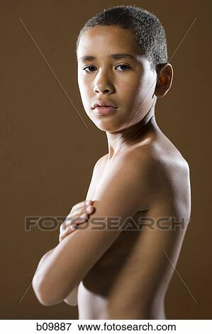 Portrait of a boy looking serious View Large Photo Image Stock Photo - Portrait of a boy looking serious. Fotosearch