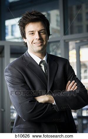 Portrait of a businessman smiling View Large Photo Image Stock Photograph - Portrait of a businessman smiling. Fotosearch