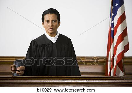 Portrait of a female judge holding a gavel View Large Photo Image Stock Photo - Portrait of a female judge holding a gavel. Fotosearch