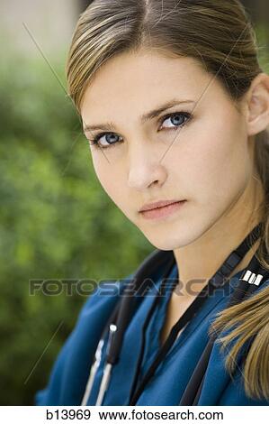 Stock Photo - Portrait of a female nurse outdoors with stethoscope. Fotosearch