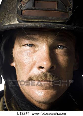 Portrait of a firefighter close-up View Large Photo Image Picture - Portrait of a firefighter close-up. Fotosearch