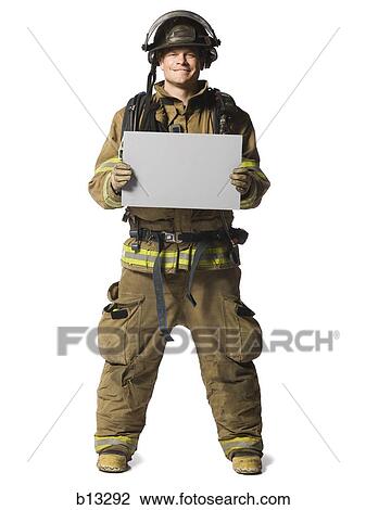 Portrait of a firefighter with blank sign View Large Photo Image Stock Image - Portrait of a firefighter with blank sign. Fotosearch