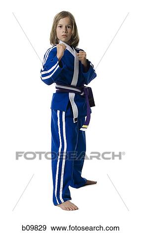 Portrait of a girl posing in a martial arts stance View Large Photo Image Stock Photo - Portrait of a girl posing in a martial arts stance. Fotosearch