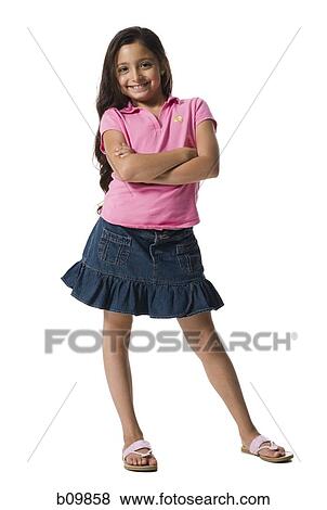 Portrait of a girl smiling with her arms crossed View Large Photo Image Stock Photo - Portrait of a girl smiling with her arms crossed. Fotosearch