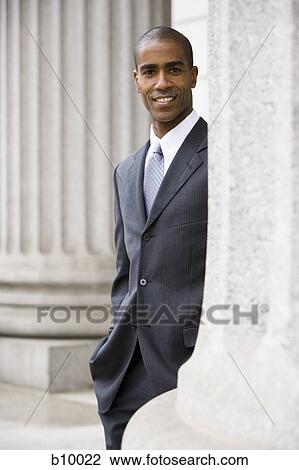 Portrait of a male lawyer standing in front of a courthouse and smiling View Large Photo Image Stock Image - Portrait of a male lawyer standing in front of a courthouse and smiling. Fotosearch
