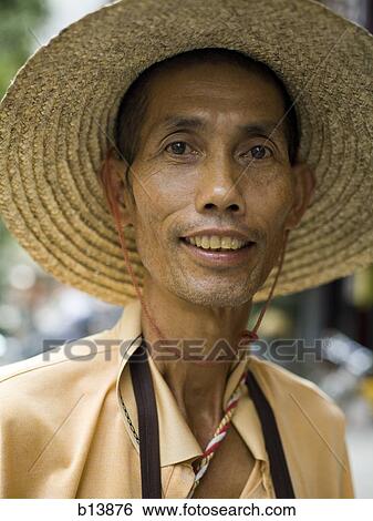 Portrait of a man in sunhat View Large Photo Image Stock Photograph - Portrait of a man in sunhat. Fotosearch