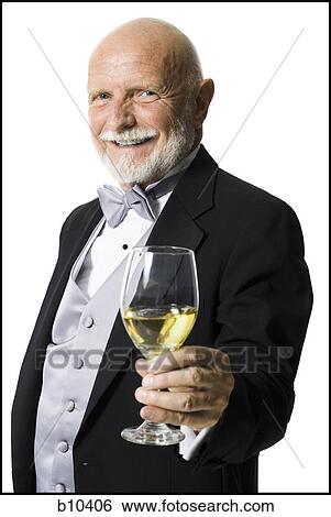 Stock Photograph - Portrait of a senior man holding a glass of wine. Fotosearch