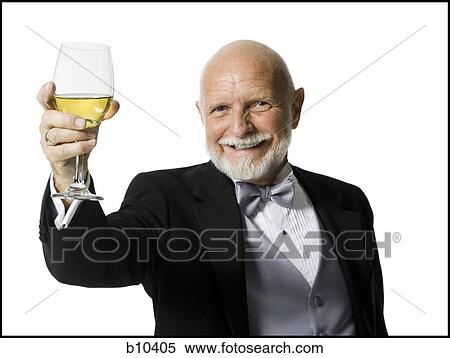 Stock Photography - Portrait of a senior man holding a glass of wine. Fotosearch